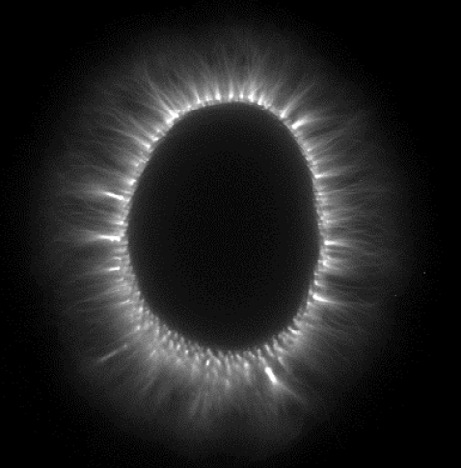 Discharge corona captured from a fingertip — a bright ring of light surrounding a dark center